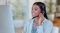 Premium stock video - A call center telemarketing agent using a headset