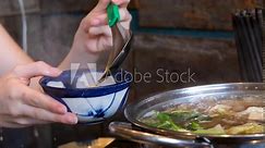 burn hand with boiling water burn girl burns hand with hot soup pour boiling broth in a large stream splashes hit skin painfully pull hand away