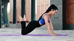 Strong fitness muscular sport woman doing push ups on floor mat training outdoor enjoy physical activity. Athletic young female practicing force workout for shoulders core exercise healthy lifestyle