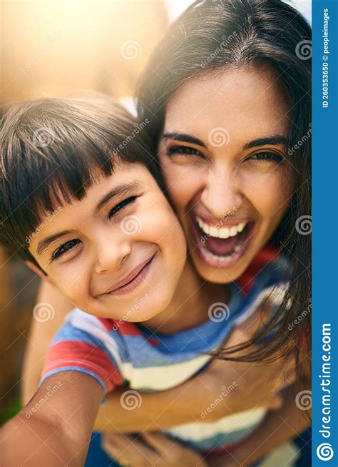 Like Mother, Like Son. Closeup Portrait of an Attractive Young Woman ...