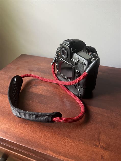 Do you use the stock neck strap or did you replace it? : r/Nikon