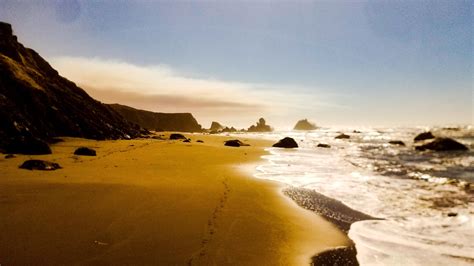 Nesika Beach, Oregon, featuring a looming smoke cloud from nearby ...