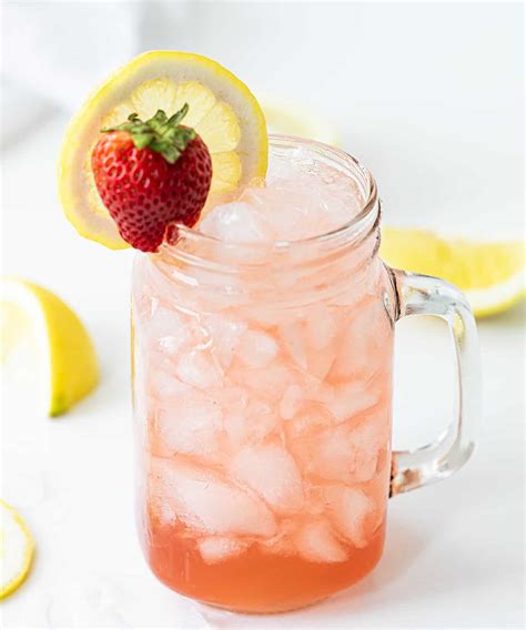 Glass Mug with Whiskey Strawberry Lemonade and a Strawberry and Lemon ...