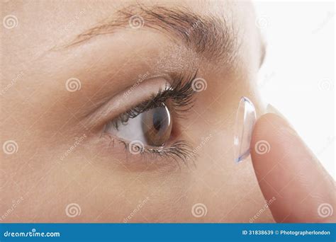 Woman Putting in Contact Lens Stock Image - Image of care, contact ...