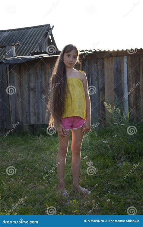Teen Girl with Long Hair in Countryside Yard, Russian Village Stock ...