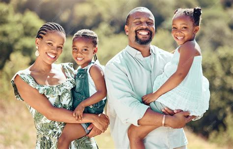 Premium Photo | Happy black family parents and kids in park garden or ...