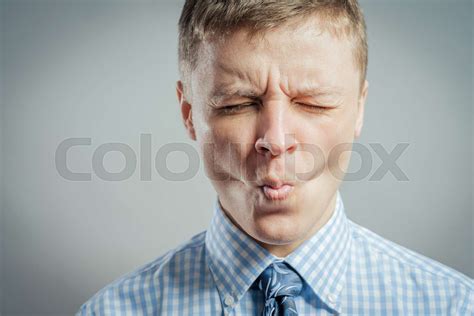 Man sucking in his cheeks | Stock image | Colourbox
