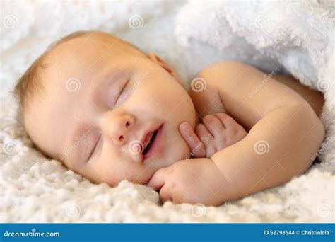 Newborn Baby Smiling In Sleep