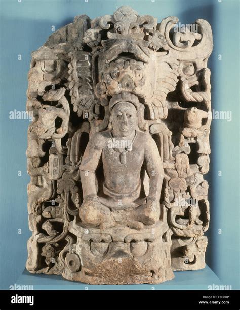 MAYAN SUN GOD, c700 A.D. /nA Mayan sun god sits with his head haloed by ...