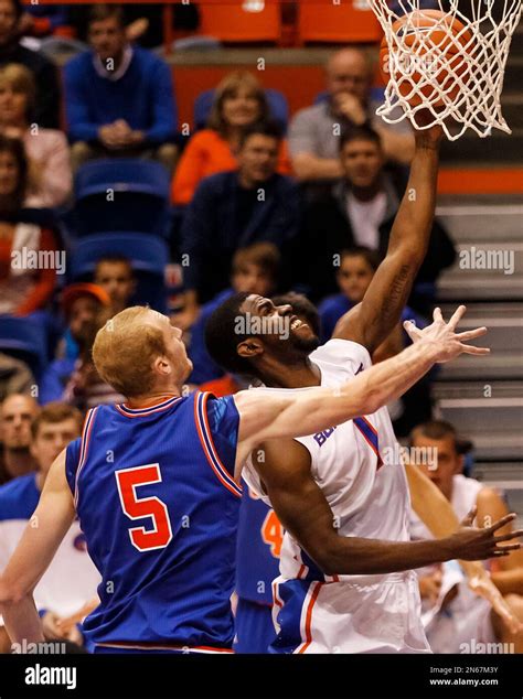 Boise State's Mikey Thompson (1) shoots past UT Arlington's Stuart ...