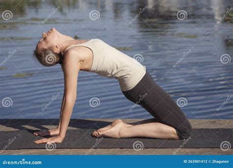 Young Naked Woman Practices Yoga on the Beach Stock Photo - Image of ...