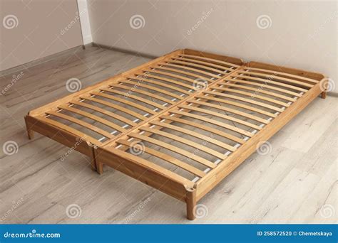 Wooden Bed Frame on Floor in Room Stock Photo - Image of apartment ...