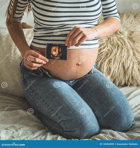 Pregnant Woman Holding Ultrasound Image. Stock Image - Image of crop ...
