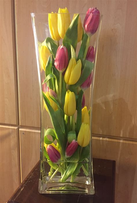 Yellow and Pink Tulip Arrangement in Glass Vase