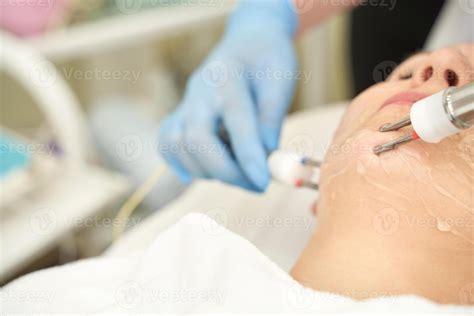 Dermatology anti age treatment. Microcurrent medicine procedure. Woman ...