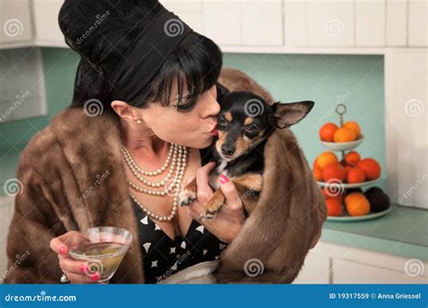 Woman Kisses a Dog stock image. Image of companion, kitchen - 19317559