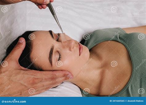 Post-surgery Rhinoplasty Care. Woman Is Having Her Nose Taped After Nose Surgery. Preventing ...