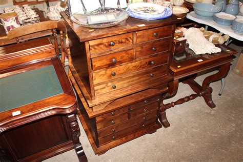 A pair of Laura Ashley hardwood nests of drawers
