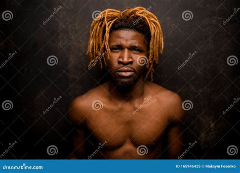 Naked Black Guy with Blonde Dreadlocks Posing in the Studio Looking at ...