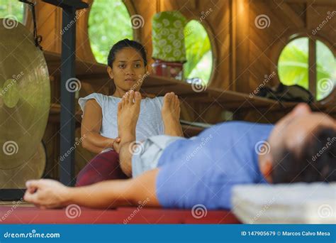Young Beautiful and Exotic Asian Balinese Wellness Therapist Giving ...