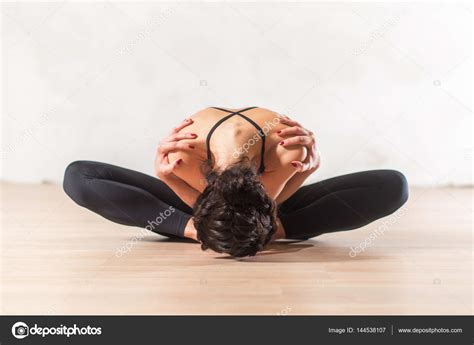 Dancer doing advanced butterfly stretch exercise Stock Photo by ©undrey ...