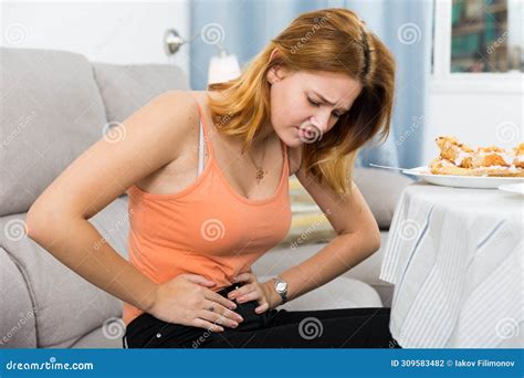 Girl is Having a Stomach Ache after Eating Many Cake Stock Photo ...