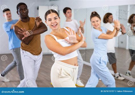 Group of Young Adult Diverse Active Dancers in Sportswear with Crossed ...
