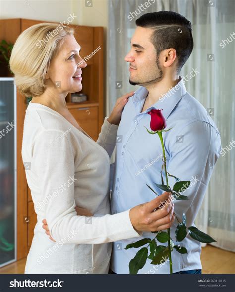 Handsome Young Man And Mature Woman Slowly Dancing And Smiling Stock ...