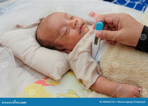Thermometer Under His Armpit Baby To Measure the Temperature of a Sick ...