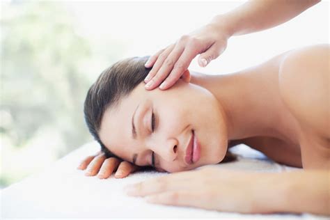 Download a woman getting a massage in a spa | Wallpapers.com