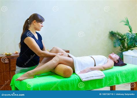 Front View of Professional Massage Therapist Giving Massage on Woman ...