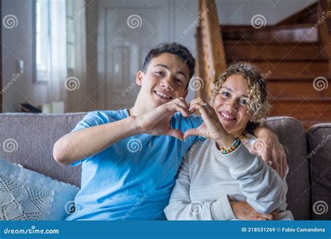 Portrait of Couple of Mom and Son Together a Home Making a Heart Love ...