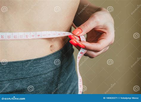 Girl Measures the Waist with a Measuring Tape Stock Image - Image of ...