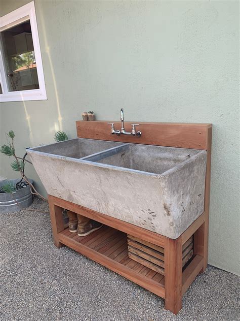 Concrete Bathroom Sink on Wooden Shelf
