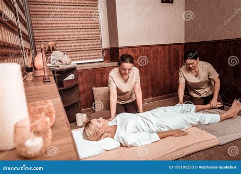 Woman Getting Four-hand Massage in Thai Massage Salon. Stock Image ...
