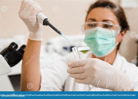 Laboratory Assistant with Dispenser in Laboratory Doing Blood Test Analysis. Medical Equipment ...