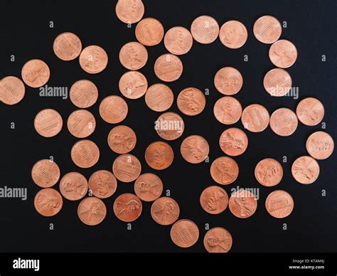 One Cent Dollar coins, United States over black Stock Photo - Alamy