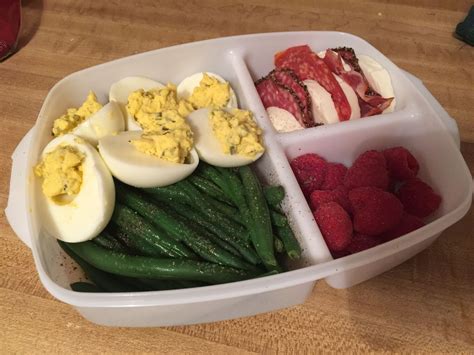 Low carb paleo bento cold lunch. Deviled eggs, green beans, sliced ...