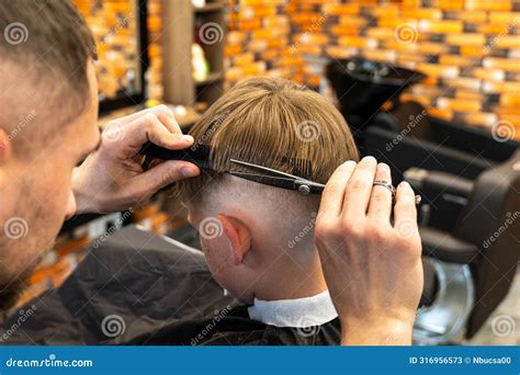 Contented Cute Preschooler Boy Shows Thumbs Up while Getting a Haircut ...