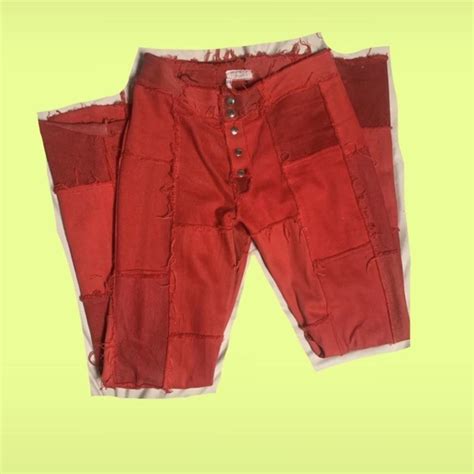 Low waisted red flared jeans (MOTOR) one small stain... - Depop