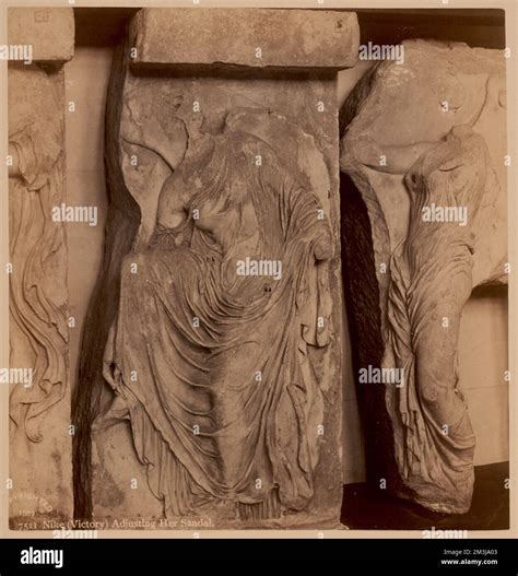 Nike Adjusting Her Sandal