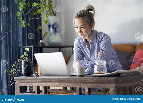 Mature Asian Woman Working from Home Using Notebook Computer Stock Photo - Image of hong, home ...