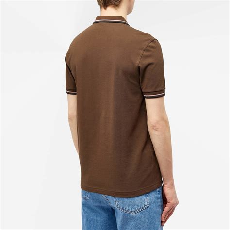 Fred Perry Men's Twin Tipped Polo Shirt in Burnt Tobacco/Dark Pink ...