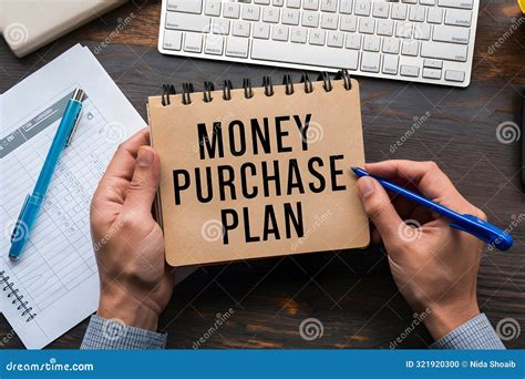 Desk with MONEY PURCHASE PLAN Notebook, Paper with Table, Blue Pen, and ...