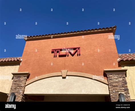 TUMI sign, logo on the store facade at Desert Hills Premium Outlets ...