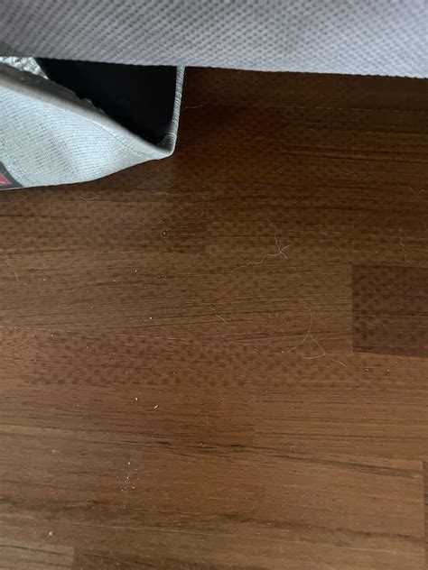 Most cost effective way to remove spots on wood floor? Left by moisture ...