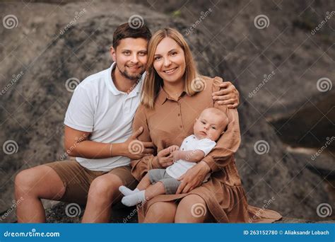 Happy Family of Three in the Summer in the Park in Nature Stock Photo ...