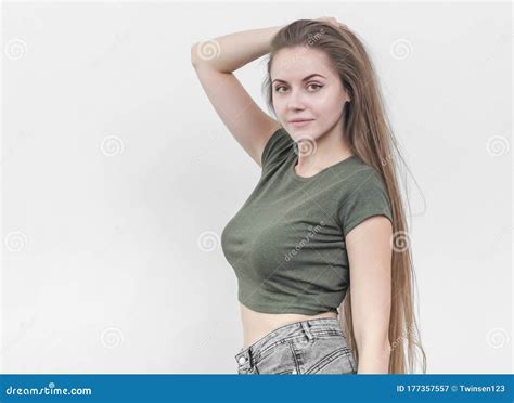 Nice Girl with Beautiful Breasts in a Green T-shirt Posing on Ca Stock ...