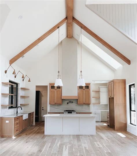 Modern farmhouse kitchen inspiration with vaulted ceilings. Open ...