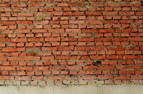 Red brick wall texture grunge background with many rows of bricks, may ...